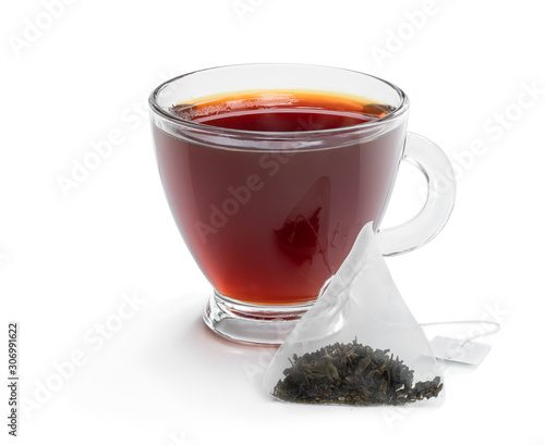 Cup of black tea with tea bag isolated on white