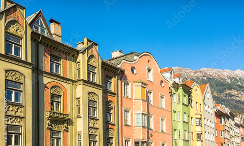 The ornate and colourful residential buildings in the famous Mariahilf district of Innsbruck town, Inn riveside, Austria, Europe. © lorenza62