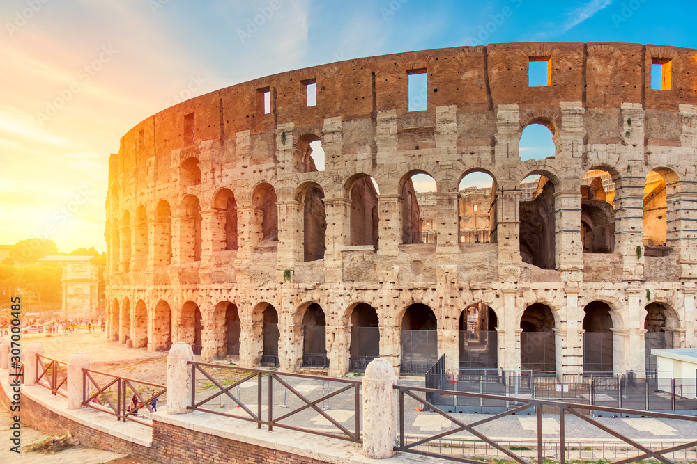 Colosseum at sunset in Rome, Italy. World famous landmark in Italy.
