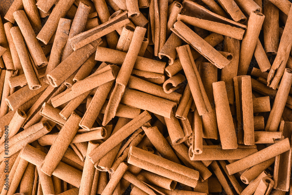 Cinnamon background. Pile of cinnamons stick top view. Cinnamon background. Pile of cinnamons stick top view.
