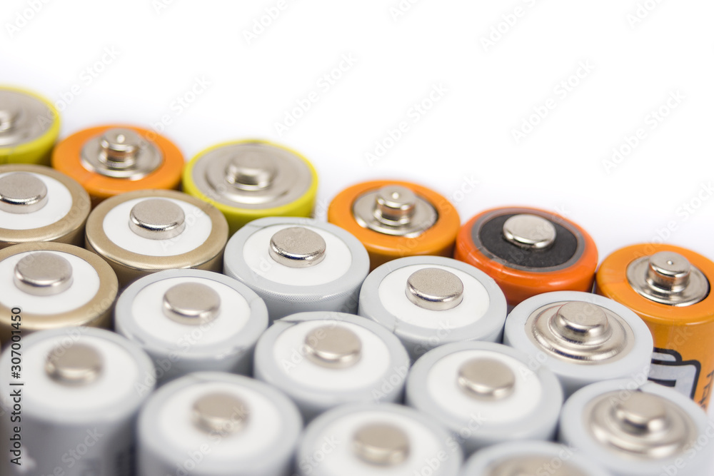 alkaline batteries multi-colored metal and the positive side of the AA-size batteries isolated on white background closeup, carbon zinc batteries, rechargeable batteries, top view mockup alkaline batteries multi-colored metal and the positive side of the AA-size batteries isolated on white background closeup, carbon zinc batteries, rechargeable batteries, top view mockup
