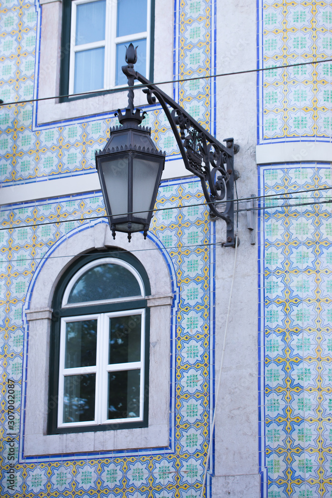 Traditional lamp architecture in Lisbon city, Portugal, azulejos tile facade Traditional lamp architecture in Lisbon city, Portugal, azulejos tile facade