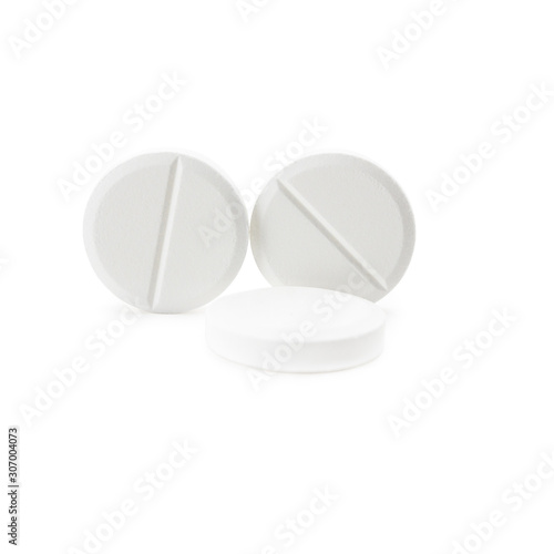 white round close-up pills macro isolated on white background