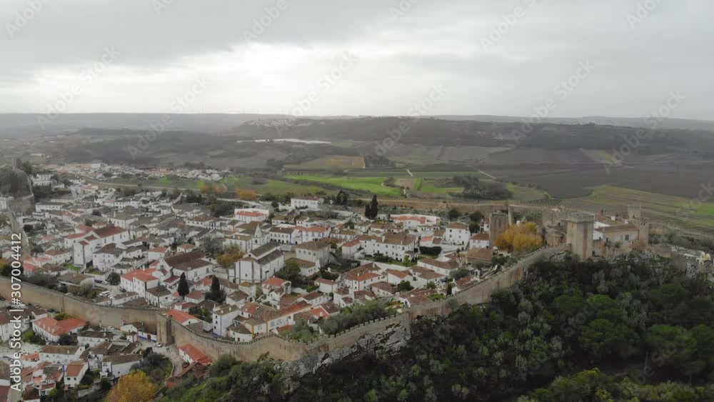 Obidos, castle town in Portugal, old walled city by drone, Aerial 4k Obidos, castle town in Portugal, old walled city by drone, Aerial 4k