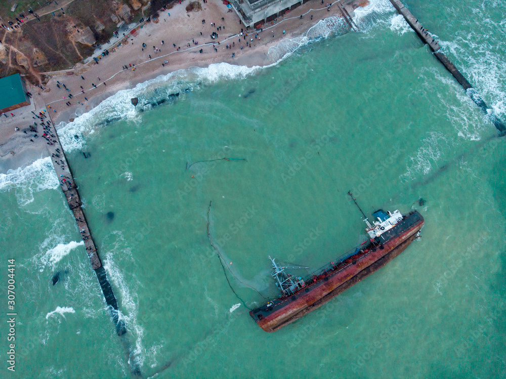 Odessa, Ukraine, November 22, 2019: Shipwreck. The ship crashed near the shore at sea. Cargo tanker. Port. Ecological disaster oil spill and oil products. Sea transport aerial