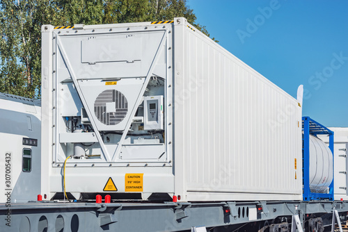Refrigerated container 20-foot-long on the railway platform.