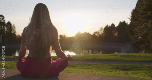 Wallpaper Mural Woman Sitting in Lotus Pose Zen Posture Meditating For Wellness Sunny Golden Hour Backlight Torontodigital.ca