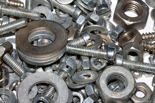 Collection of Old Bolt, Screws, Nuts Engineering Metal Tools on White Background © squeebcreative