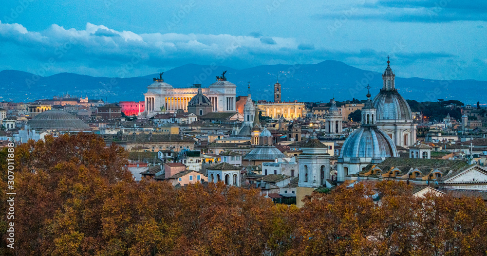 Rome skyline in the evening, as seen from Castel Sant'Angelo, with the dome of Saint Agnese Church, the Campidoglio and the Altare della Patria monument.