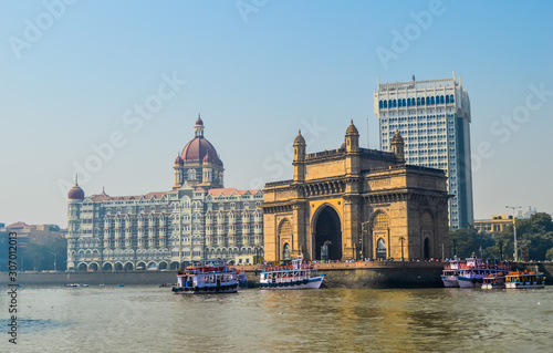 Beautiful Gateway of India near Taj Palace hotel on the Mumbai harbour with many jetties on Arabian sea
