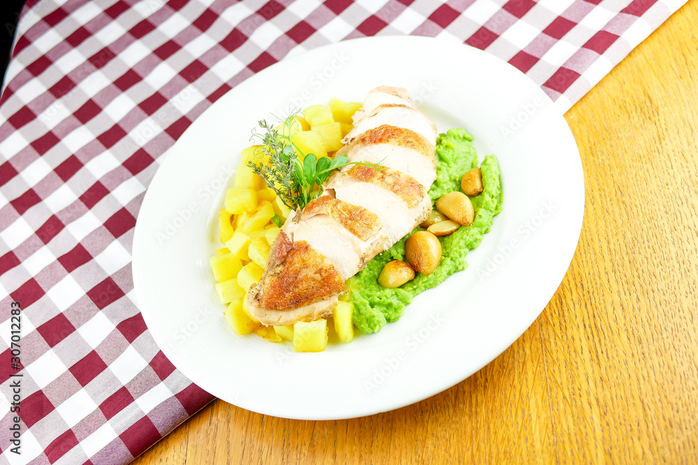 Chicken dish on a restaurant table Chicken dish on a restaurant table