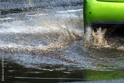 Wallpaper Mural Car and water splash after rain on road Torontodigital.ca