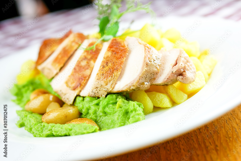 Chicken dish on a restaurant table Chicken dish on a restaurant table