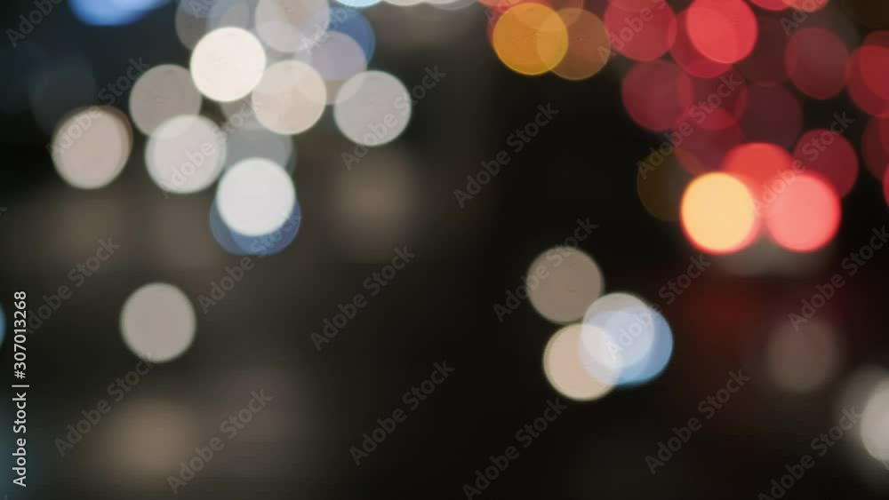 Blurred footage of transport in Ho Chi Minh. Travel in Ho Chi Minh city by a motorbike. Royalty high-quality free stock footage of slow moving traffic with lots of motorbike, bus, car in night city