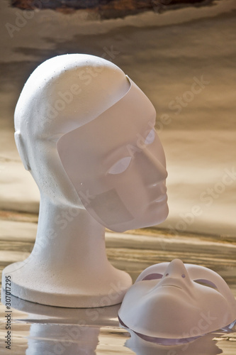 White mannequin head and masks
