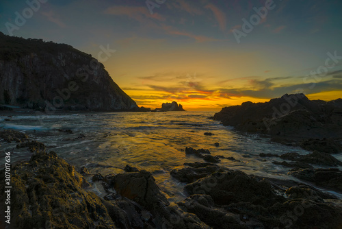 Asturias, sunset on the beach of Gueirua in the Cantabrian Sea