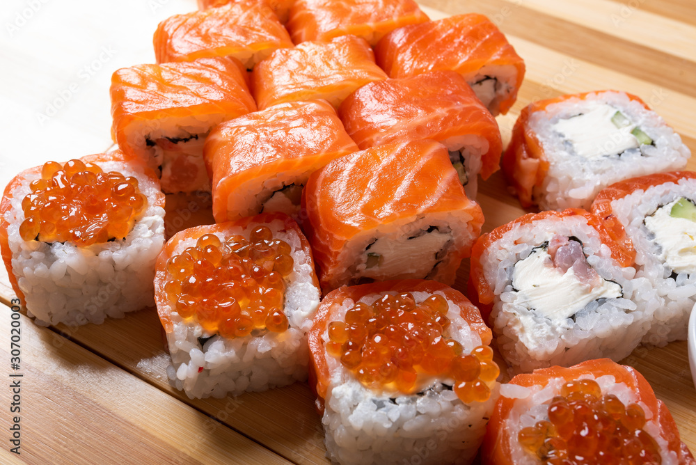 Sushi set with salmon. Philadelphia., with caviar. With ginger and wasabi. Close-up.