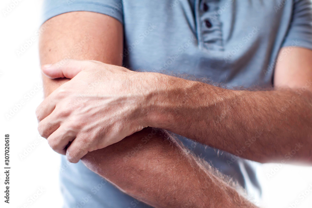 Man feels strong elbow pain isolated. People, healthcare and medicine concept