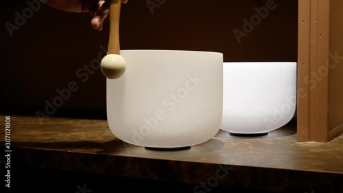 Person Uses Crystal Singing Bowl