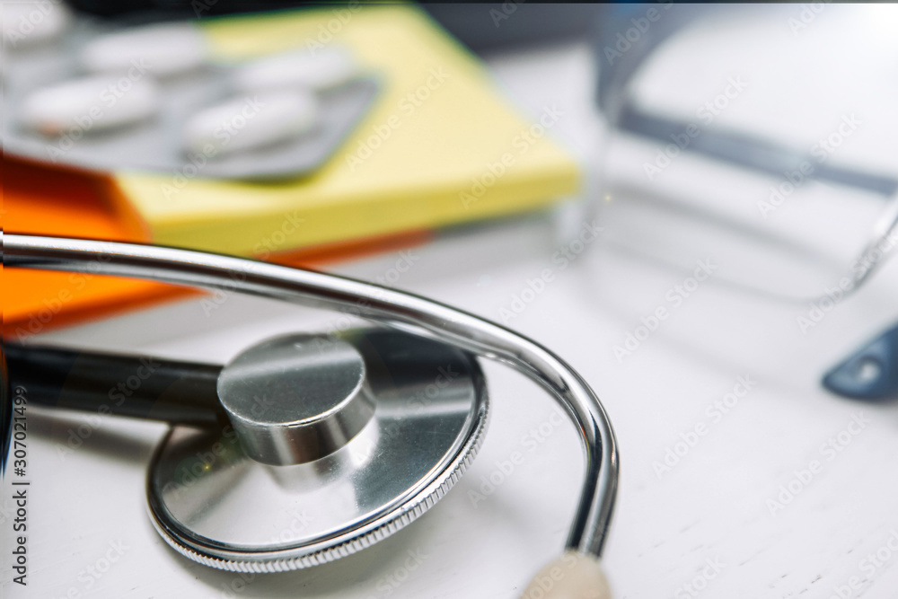 Medical and pharmaceutical concept, antibiotic pills stethoscope on the doctor’s desktop. Medical and pharmaceutical concept, antibiotic pills stethoscope on the doctor’s desktop.