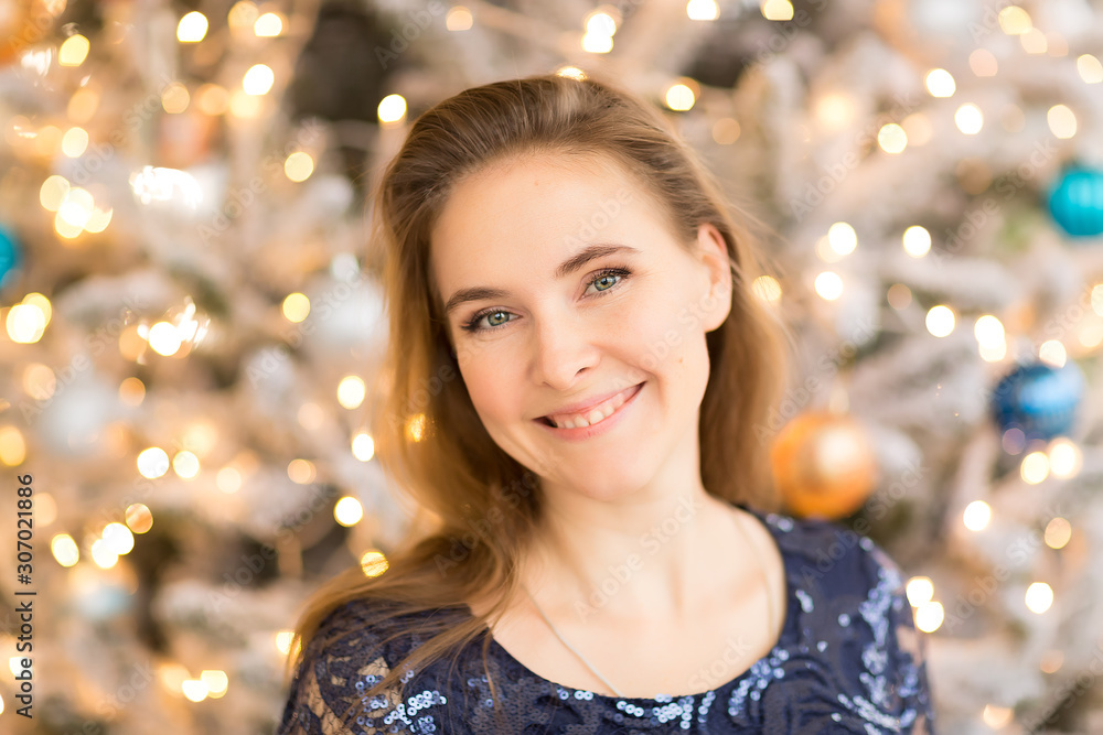 portrait of a girl on the background of Christmas tree lights portrait of a girl on the background of Christmas tree lights