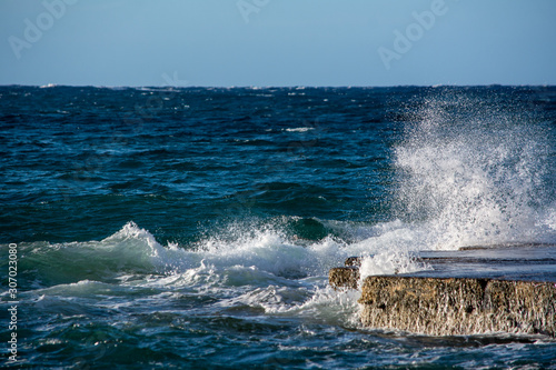 Waves hitting rock platform in Malta