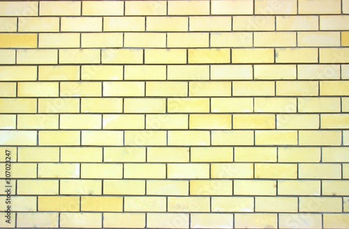 Light yellow smooth brickwork of an apartment building built in our days. Good background for different screensavers