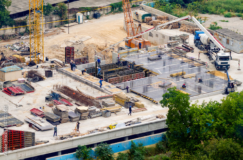 Aerial view of construction site, construction of new building in residential area