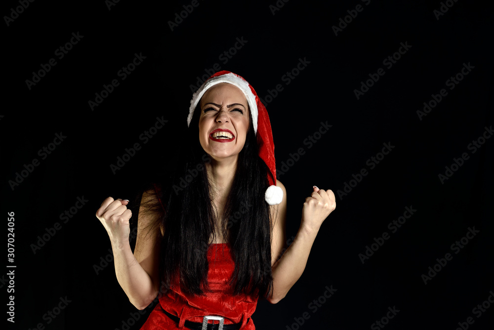 Portrait of astonished person raising her fists screaming wow omg have festiev event wearing stylish skirt dress isolated over black background Portrait of astonished person raising her fists screaming wow omg have festiev event wearing stylish skirt dress isolated over black background