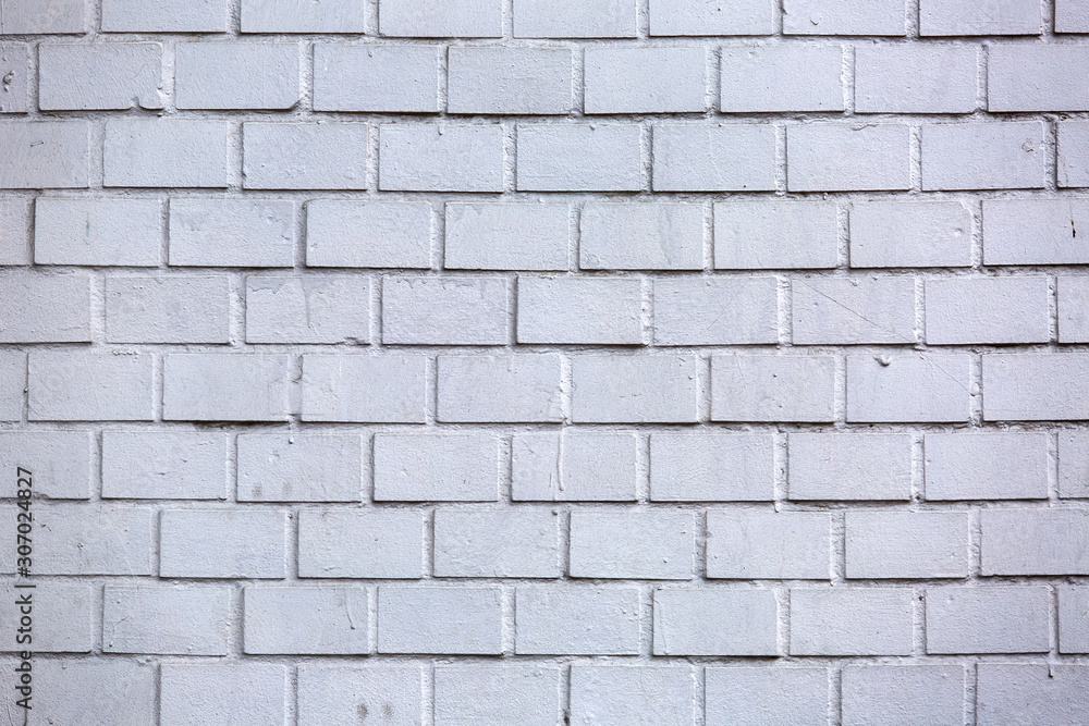 Fototapeta premium Texture of a white brick wall.