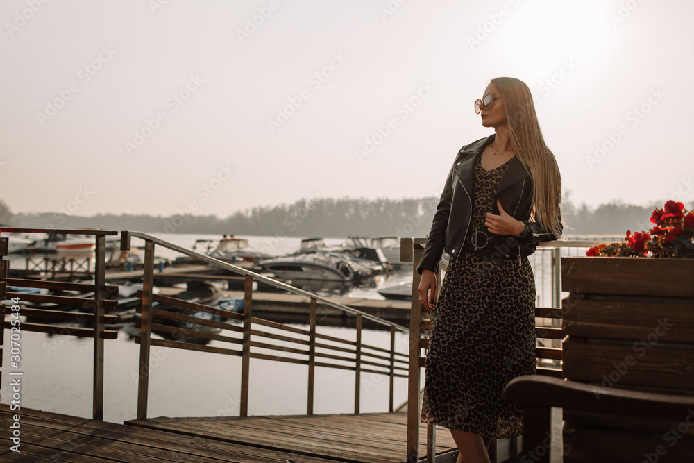 Young businesswoman working. Against the background of a yacht, water Young businesswoman working. Against the background of a yacht, water