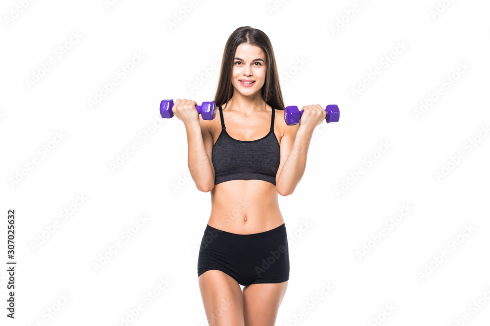 Portrait of a young pretty woman holding weights and doing fitness against white background Portrait of a young pretty woman holding weights and doing fitness against white background
