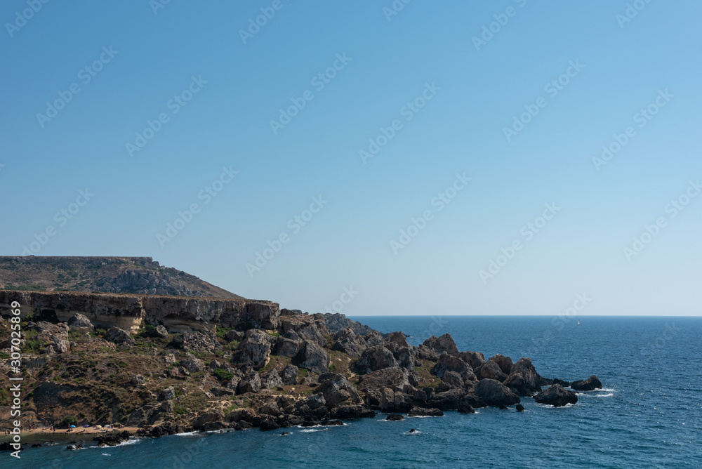 Rocks at the sea shore. Ghajn Tuffieha, Golden Bay, Malta. 