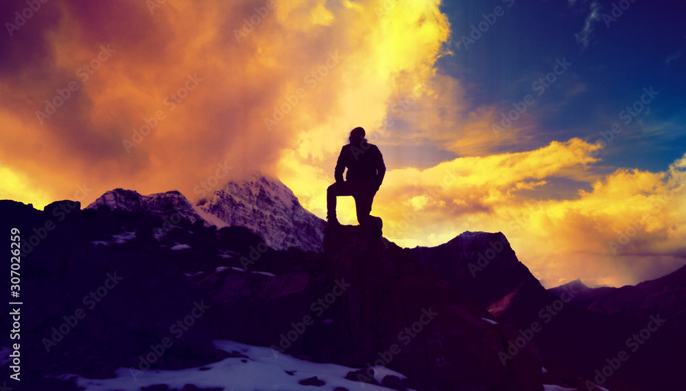 Man Kneeling On Top Of Mountain Peak Serenity Concept 