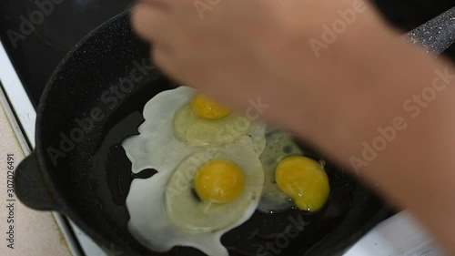 Fried egg in a pan in oil. Footage