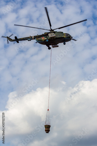 Obninsk, Russia - September 2019: Civil Defense exercises. Fire extinguishing from a helicopter Mi-8MT
