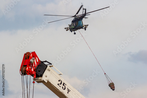 Obninsk, Russia - September 2019: Civil Defense exercises. Fire extinguishing from a helicopter Mi-8MT