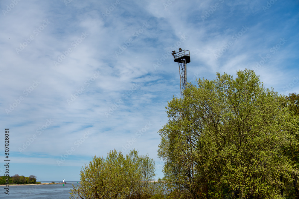Observation tower with copy space. Blue sky and green trees. Observation tower with copy space. Blue sky and green trees.