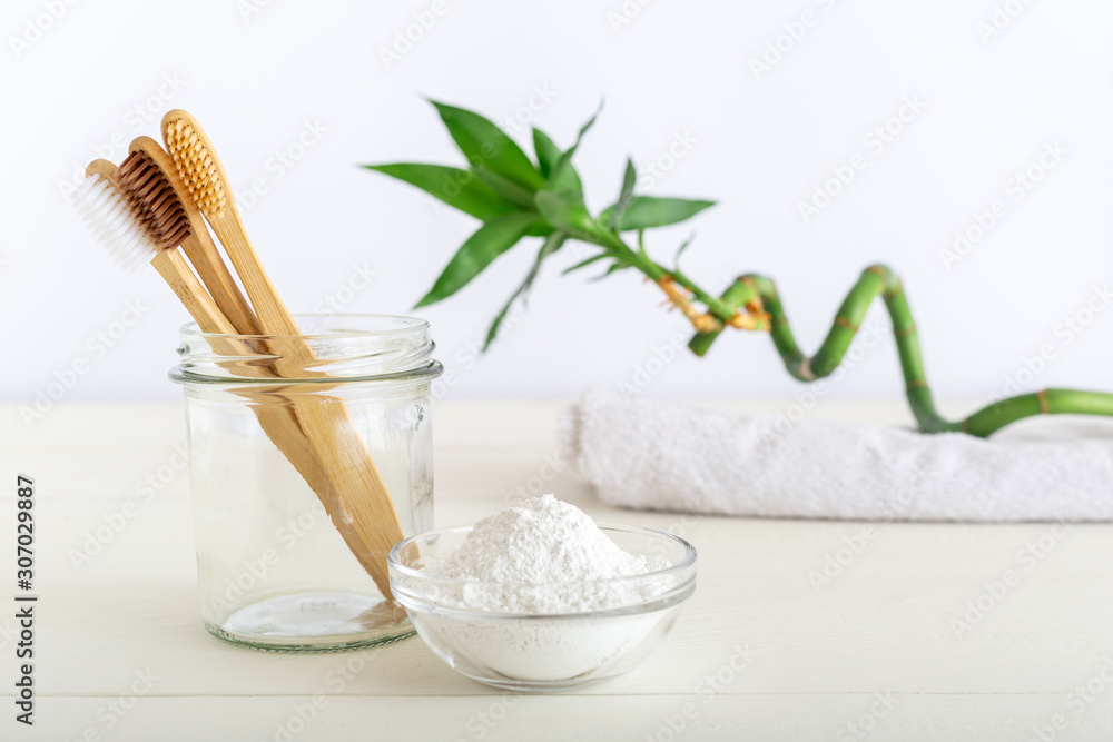 Bamboo toothbrushes, dentifrice tooth powder on white background. Natural bath products, bamboo plant.Biodegradable natural bamboo toothbrush.Eco friendly, Zero waste, Dental care Plastic free concept Bamboo toothbrushes, dentifrice tooth powder on white background. Natural bath products, bamboo plant.Biodegradable natural bamboo toothbrush.Eco friendly, Zero waste, Dental care Plastic free concept