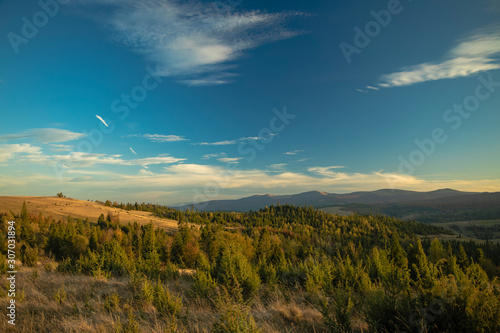 horizon panorama mountain highland forest landscape top view autumn season time colorful lighting and vivid blue sky background 