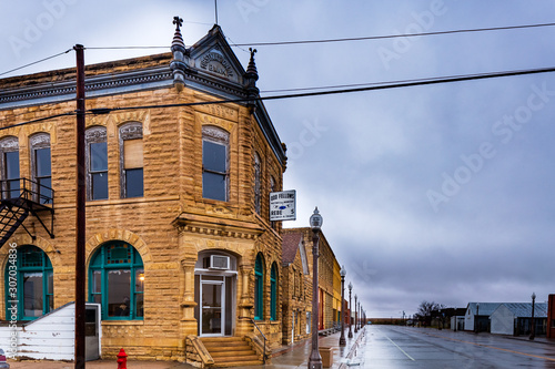Beautiful limestone buildings  from the late 1880s still form the core of rural downtown Jetmore, Kansas. photo