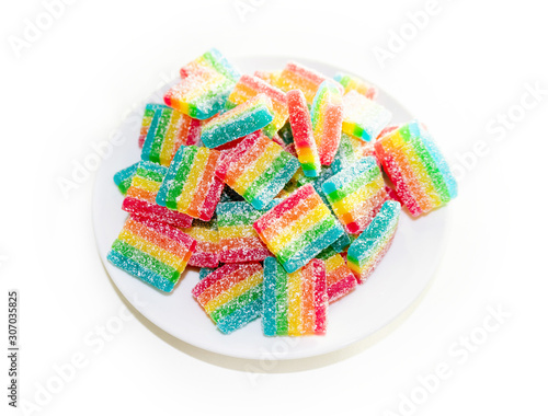 bunch of chewy candies in a white plate on a white background