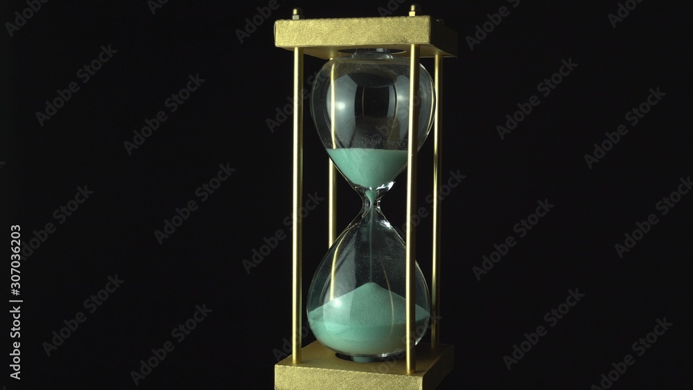 Floating in the air or levitating, sand move through hour glass. Close up  of hourglass clock. Old time classic sandglass timer. Closeup sand is  flowing down the bottom. Stock Photo | Adobe
