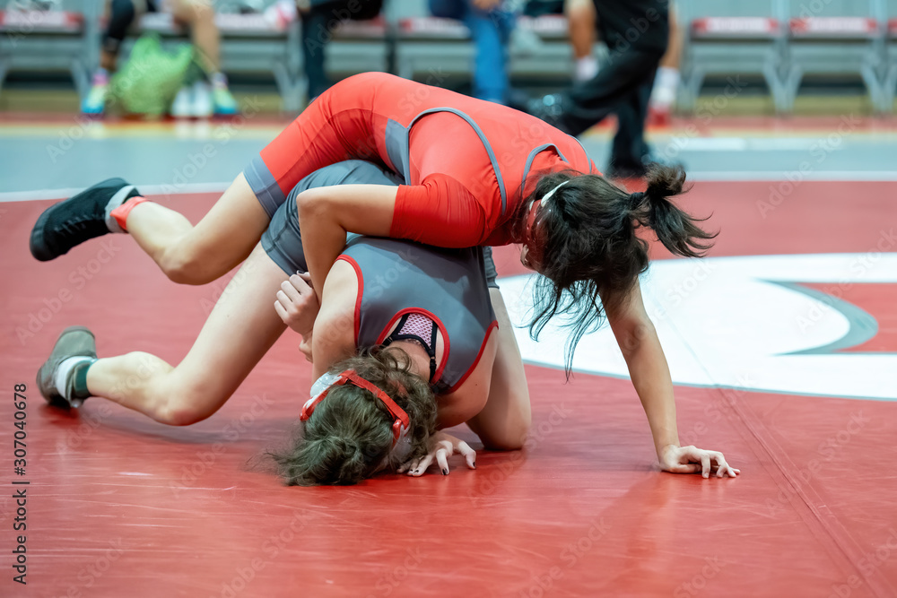 Girl High School wrestlers competing at a wrestling meet Stock Photo