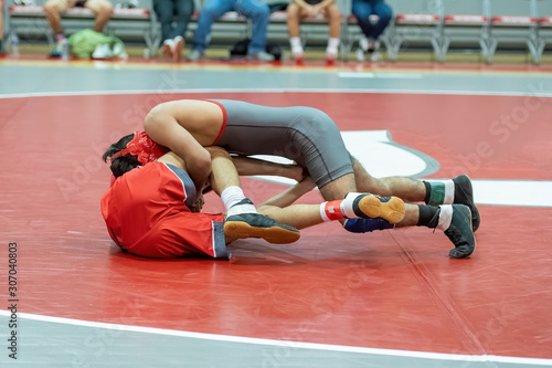 Boy High School wrestlers competing at a wrestling meet