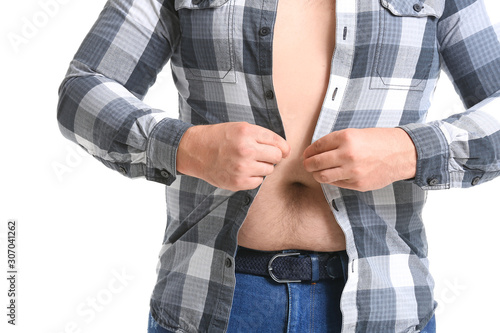Overweight man putting on t...