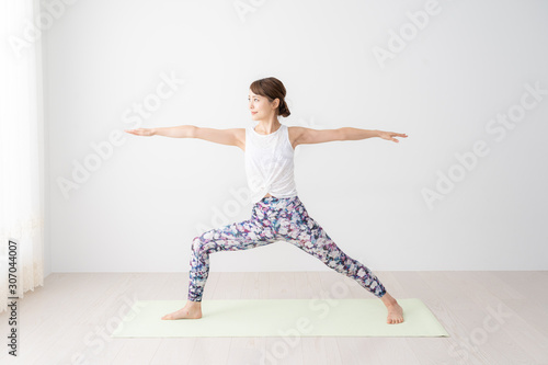 young woman doing yoga exercise
