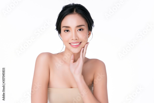 Beautiful young Asian woman touching soft cheek and smile with clean and fresh skin. Happiness and cheerful with, on white background, Beauty and Cosmetics Concept,