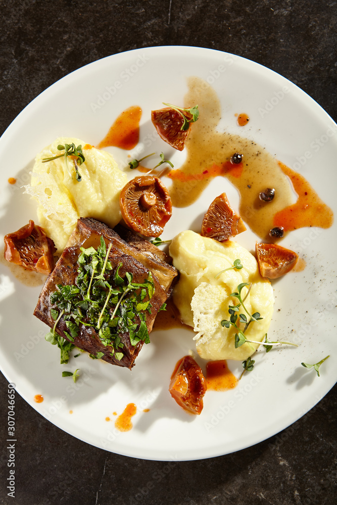 Beef brisket and mashed potato on white plate Beef brisket and mashed potato on white plate
