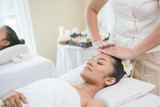young woman getting spa treatment at beauty salon. spa face massage. facial beauty treatment. spa salon.
